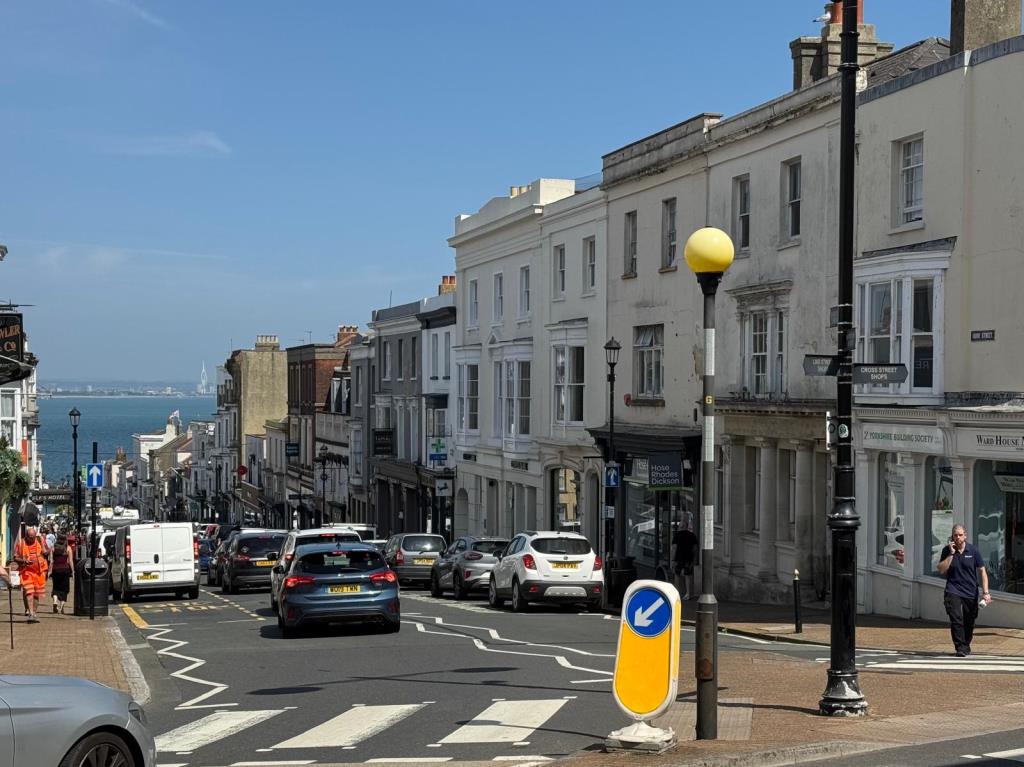 Lot: 114 - FREEHOLD FOUR STOREY TOWN CENTRE SHOP AND UPPER PARTS WITH CONVERSION POTENTIAL - View looking down Union Street towards The Solent